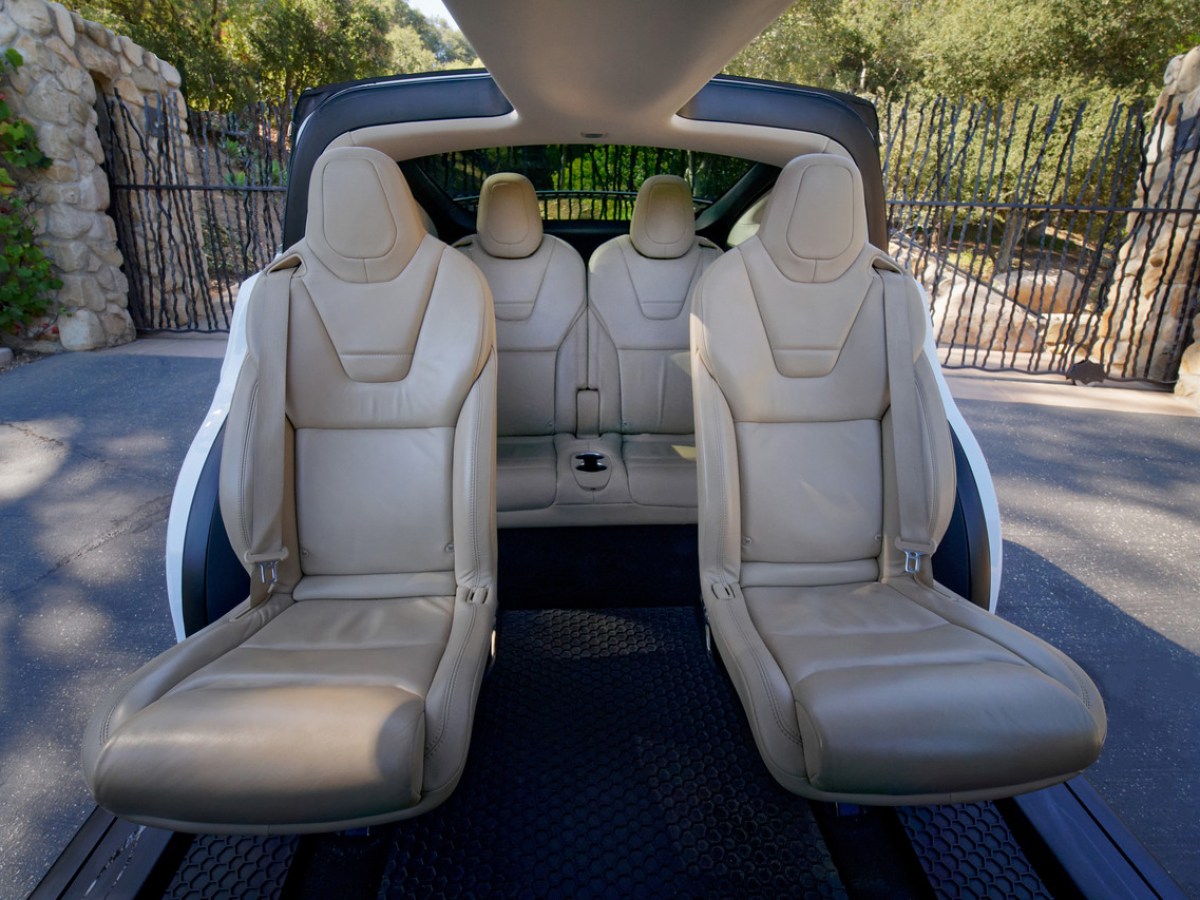 a person sitting in a parking lot