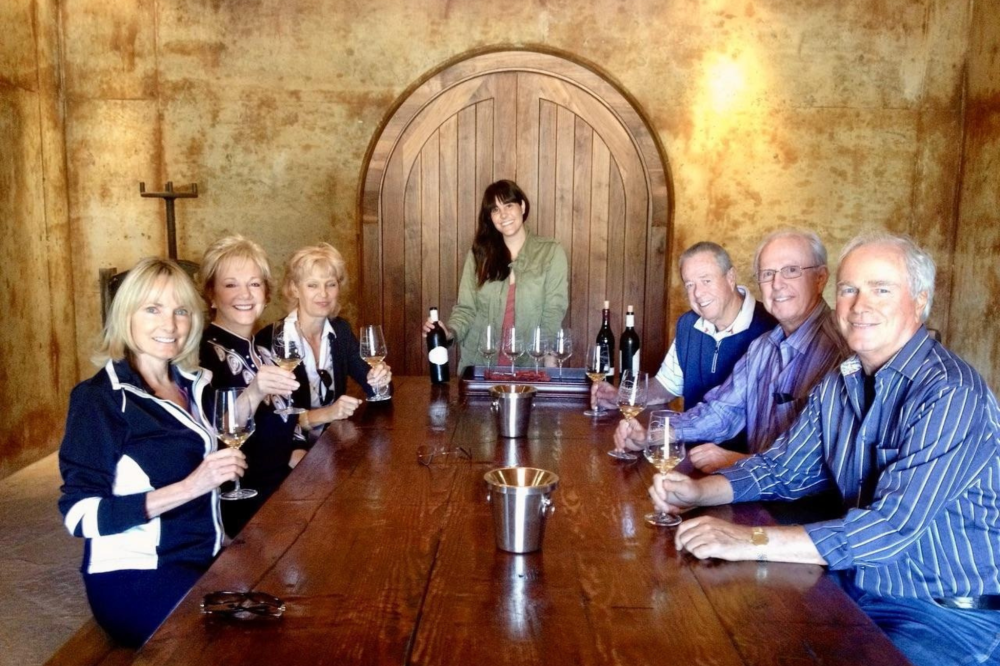 Guests enjoying Pinot Noir tasting during Santa Barbara wine tour.