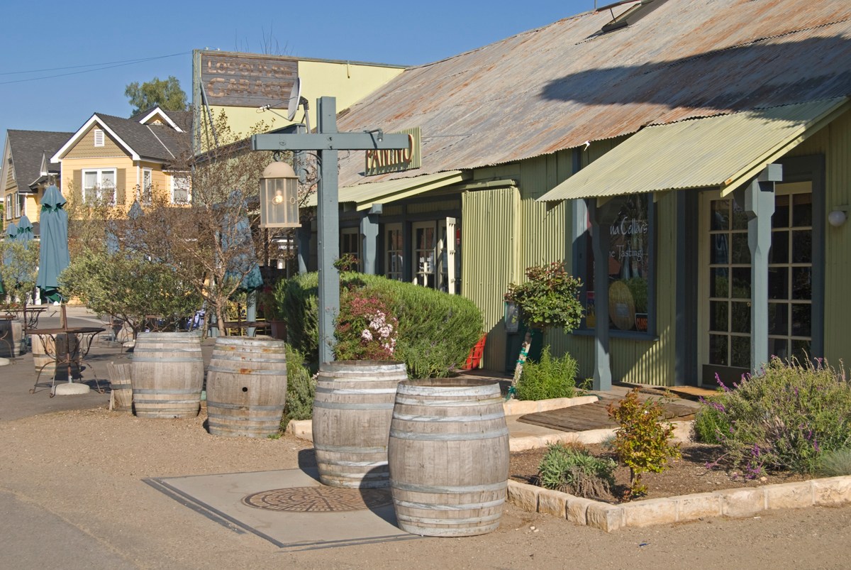 Los Olivos tasting room with barrels and rustic charm.